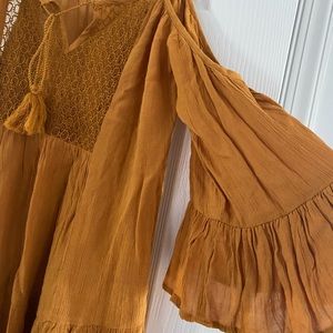 Dark yellow tunic off the shoulder